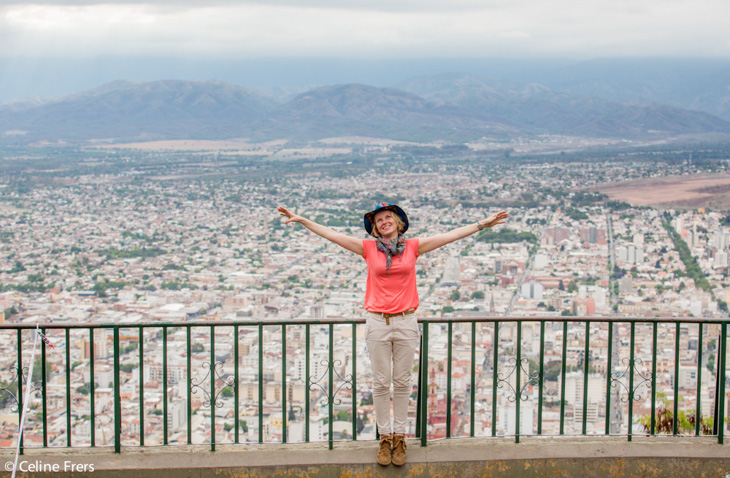 A lady stands at a mirador for a skyline view of Salta, Argentina