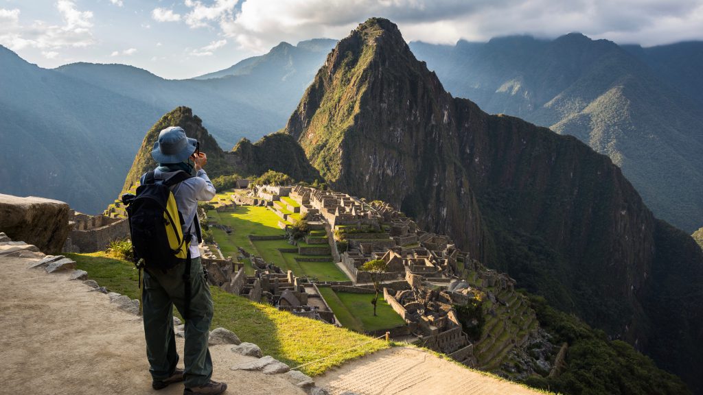 Inca trail packing list - Tourist photographing Machu Picchu.