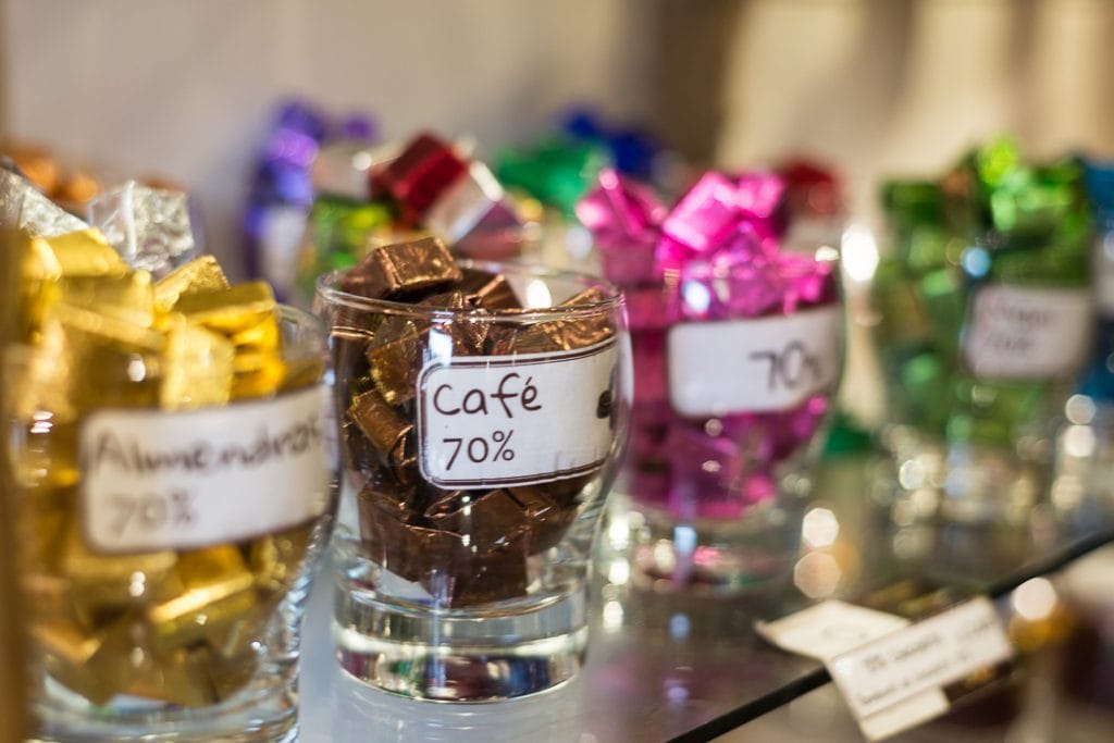 Cusco's chocolate museum - A display of glass cups holding various chocolates from the ChocoMuseo