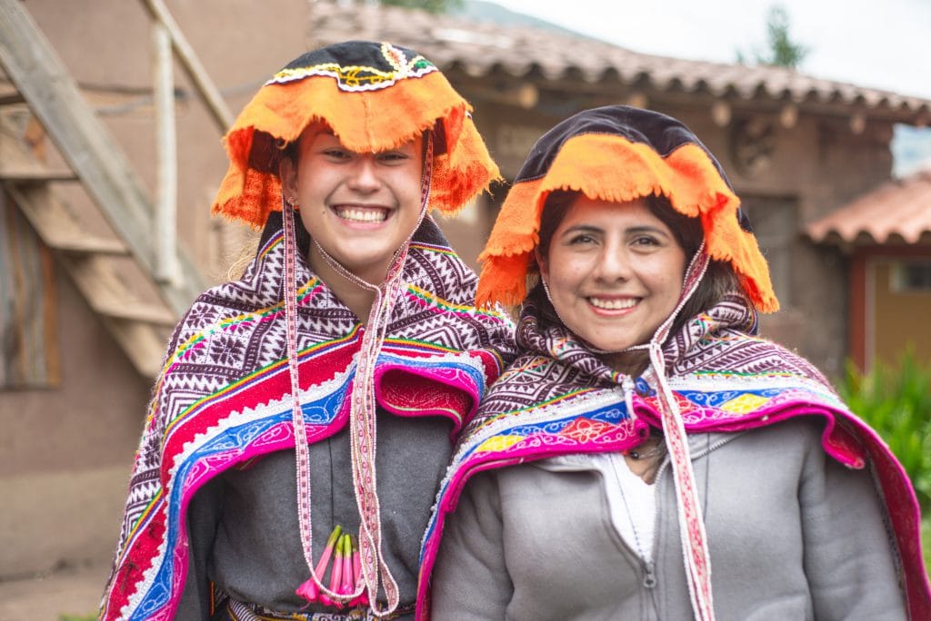 Peruvian textile weaving - Dressing in traditional costume.