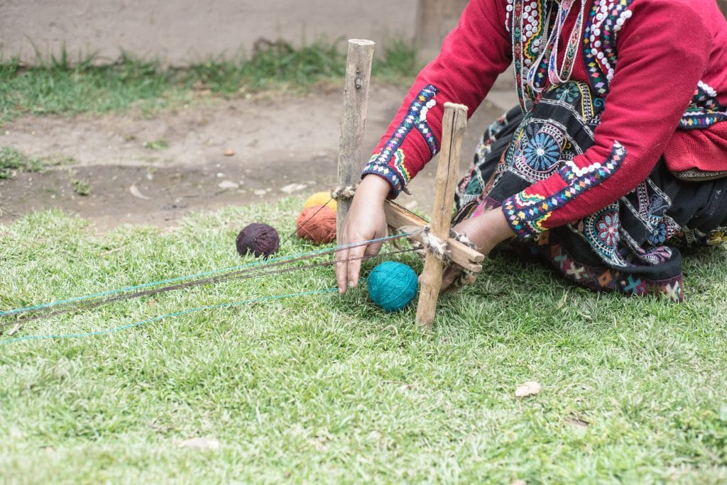 Peruvian Weaving - Women establish the framework for their scarf