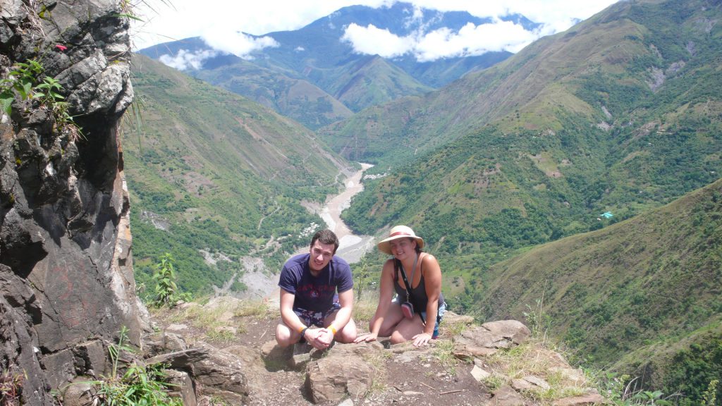 Inca Jungle Trail - Two hikers in front of a lovely valley viewpoint.