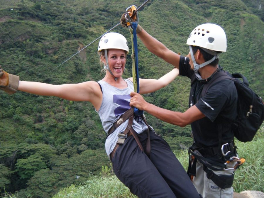 Inca Jungle Trail - Excited girl gets strapped into zipline.