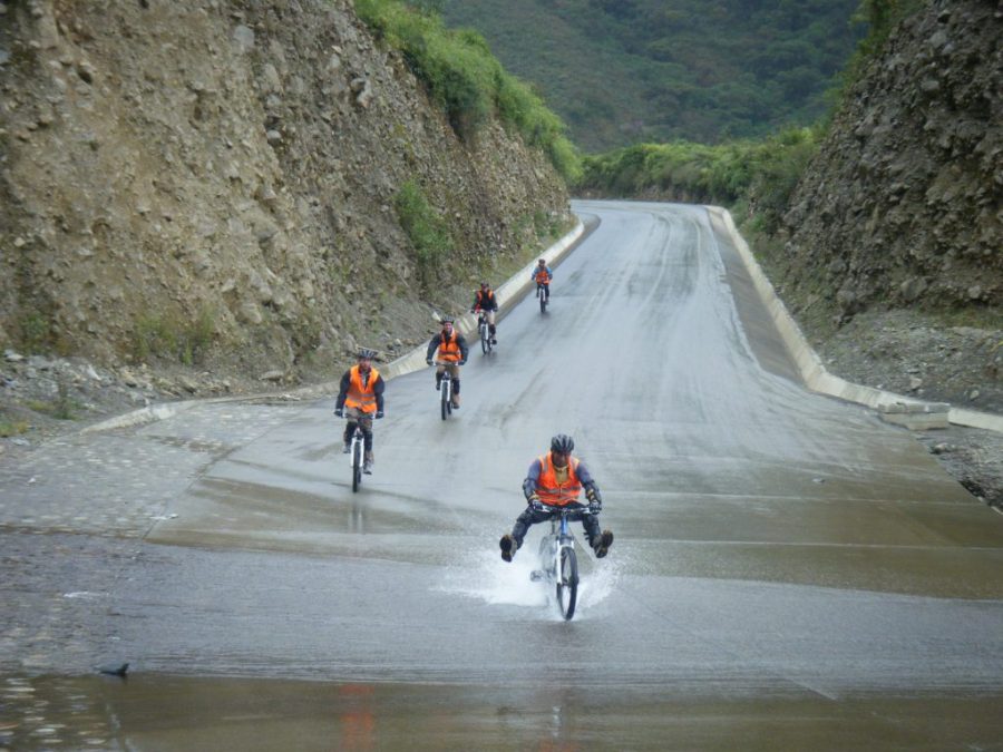 Inca Jungle Trail - Riding bikes through puddles. 