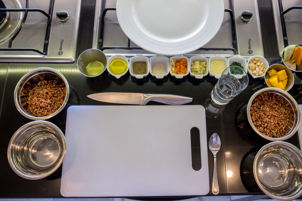 Cooking class in Cusco - Cooking station with chopping board and spices.