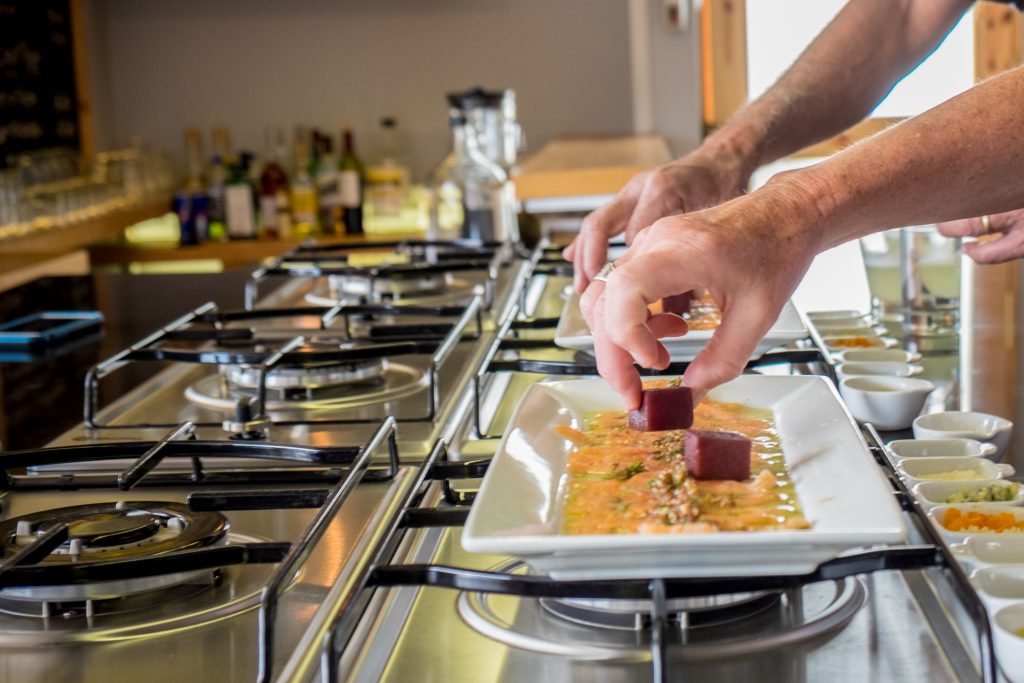 Cooking class in Cusco - Placing the finishing touch on a dish.