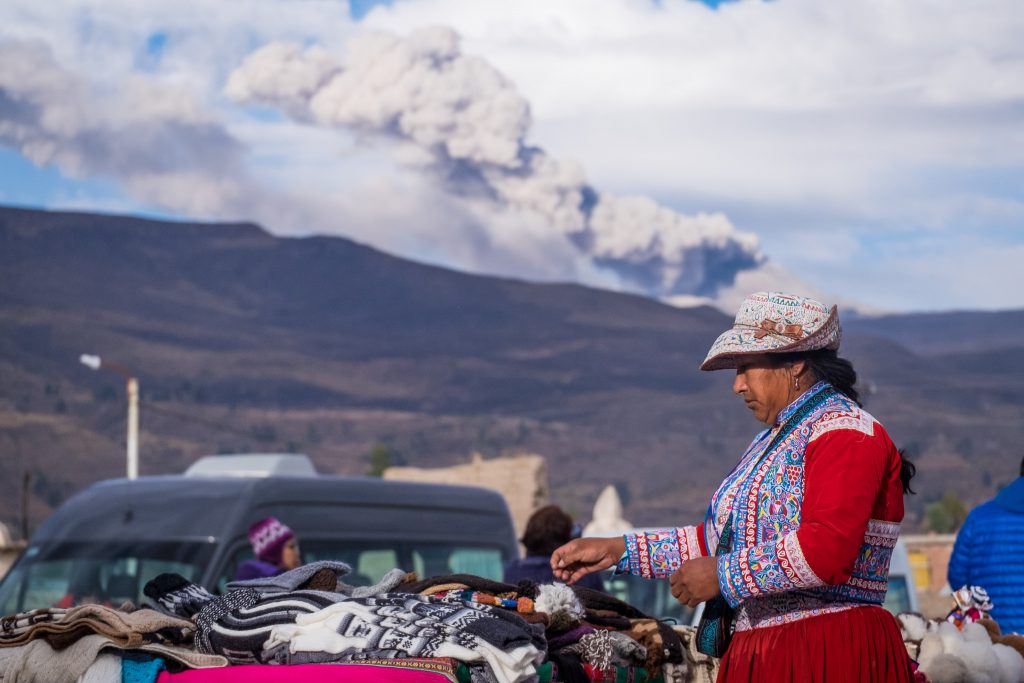 Homestay tours in Colca Canyon - local woman at Yanque market.